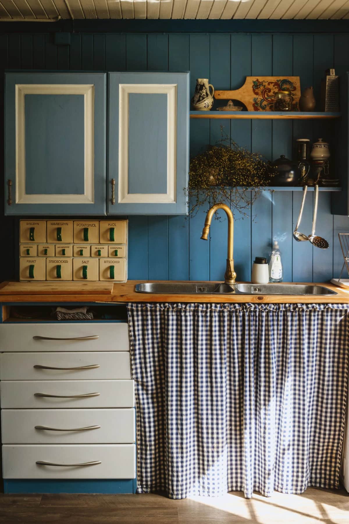 Example — AI-generated redesign: Kitchen photo compared with a Scandinavian-inspired visual restyle — Before